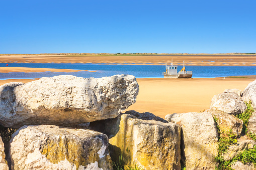 Coastal landscape - view of the Atlantic coast at low tide near the town of La Palmyre, the Nouvelle-Aquitaine region, in the south-west of France