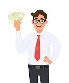 istock Young businessman showing cash, money in hand. Person holding currency notes and posing hand on hip. Male character design illustration. Business and financial, lifestyle concept in vector cartoon. 1182252461
