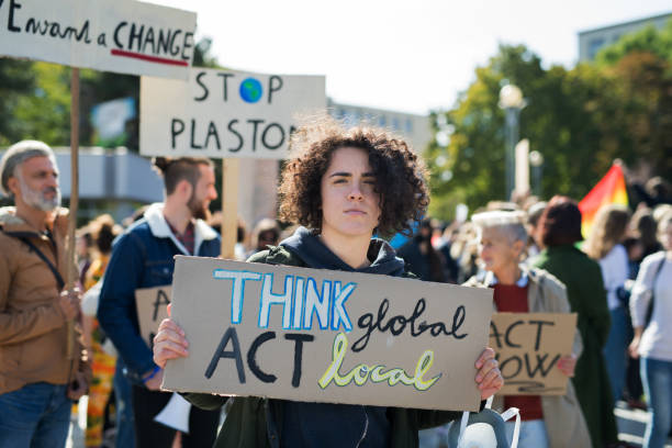 istock People with placards and posters on global strike for climate change. 1182252738