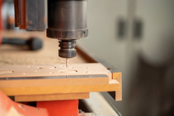CNC Lathe machine working on wood to lathe and shaping.