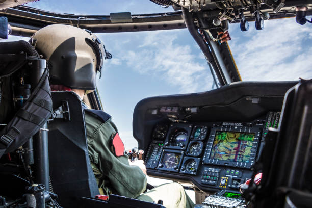 istock Army Helicopter Pilot riding military helicopter 1182254564