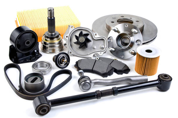 istock Auto parts background. Hub, pump, brake pads, filter, timing belt, rollers, constant velocity joints, thermostat and other on white background. Set of spare parts for repair 1182254803