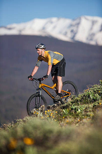 istock Young Man Mountain Biking In Rocky Mountains 118225838