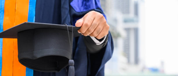 istock Close up Graduation holding graduation cap education concept 1182259298