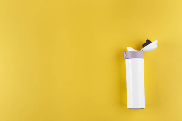 istock white thermos for travel, on a yellow background. 1182261133