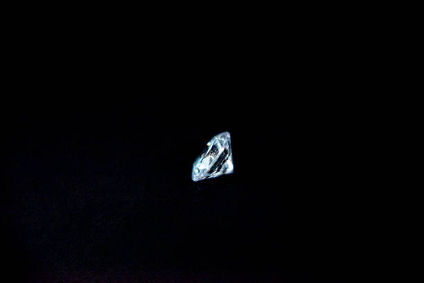 istock one diamond of classic shape on the black background 1182262316
