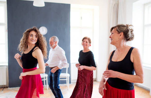 istock Group of senior people in dancing class with dance teacher. 1182263431