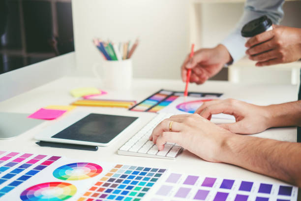 istock Graphic designer drawing on graphics tablet at workplace 1182263460