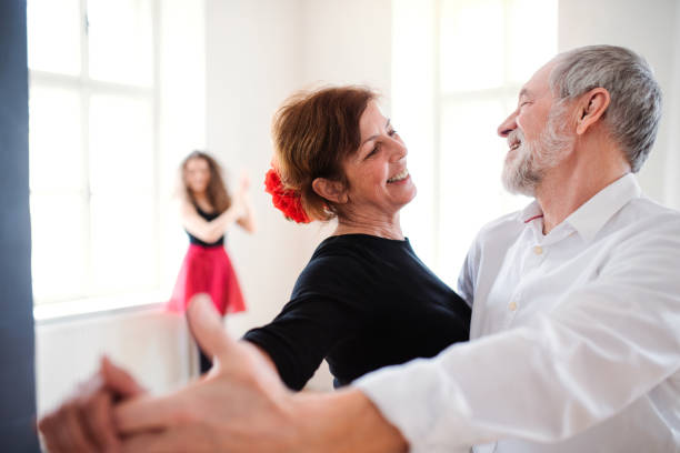 istock Group of senior people in dancing class with dance teacher. 1182263464