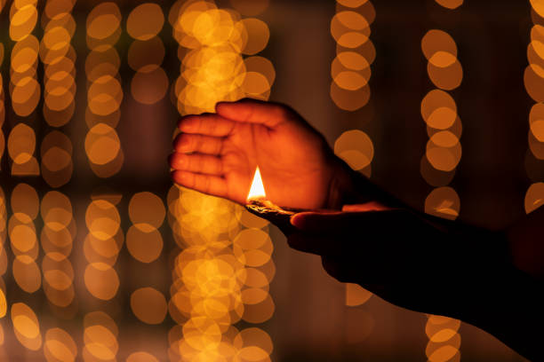 istock Female Holding Diya Celebrating Diwali 1182265795