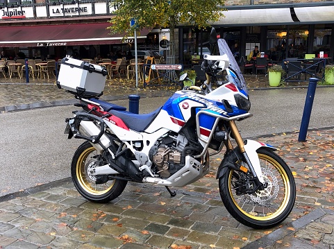 La Roche, Belgium - October 20, 2019: Honda Africa Twin motorcycle parked by the side.