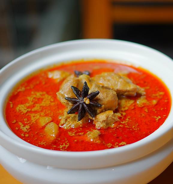 istock Red chicken curry with aniseed in ceramic bowl 1182269406