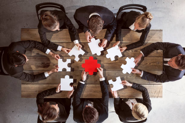 istock Business people and puzzle 1182269650