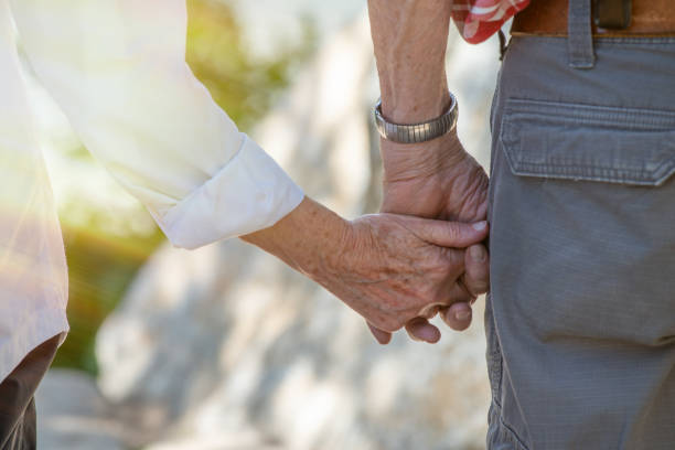istock Holding hands. Grow old together holding hands 1182269746