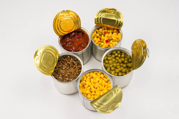 istock Canned food on white background. Green pea, beans, corn, lentils. 1182273722