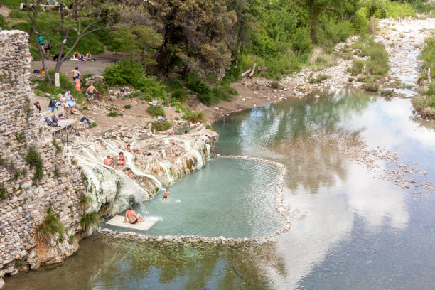 Tourist in hot springs Bagni di Petriolo - Monticiano in Italy. stock photo