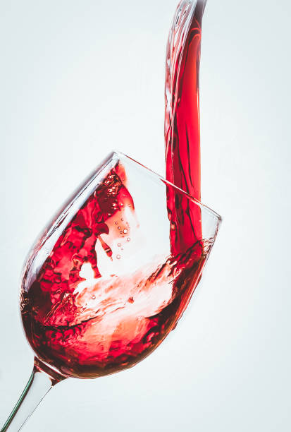 istock pouring red wine in a glass 1182279044