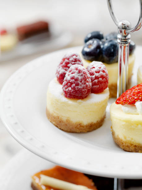 istock Mini Cheesecakes on a Three Tier Stand of Desserts 1182280583