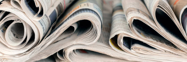 istock Newspapers, world news information concept, close-up, panoramic 1182280765