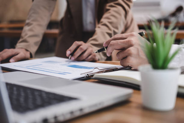 istock Business team colleague working with new startup project plan and discussion information for financial strategy with laptop, results of their successful teamwork 1182282561