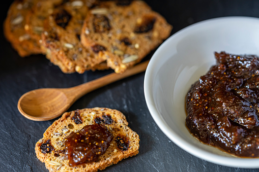 Figs and fig preserve with mini grain-toasts