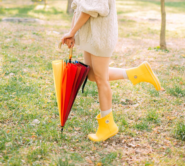 istock autumn yellow leaf fall conceptual girl park 1182289810