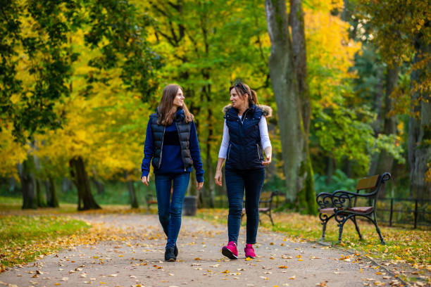 istock People walking in city park 1182291476