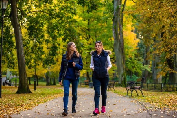 istock People walking in city park 1182291649