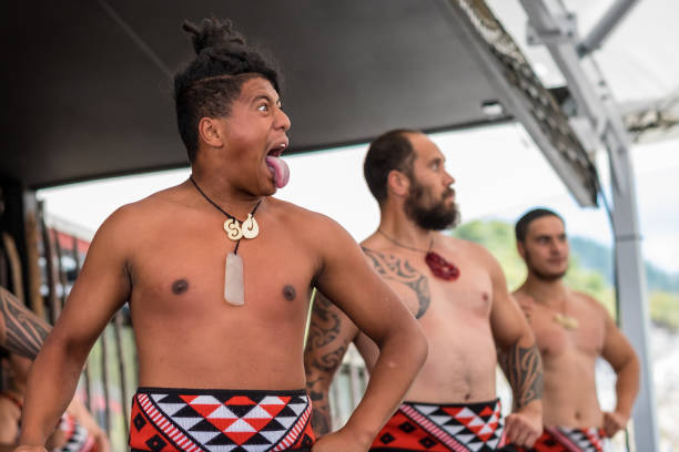 Haka performance by 3 Maori man. The Maori are the indigenous Polynesian people of New Zealand. stock photo
