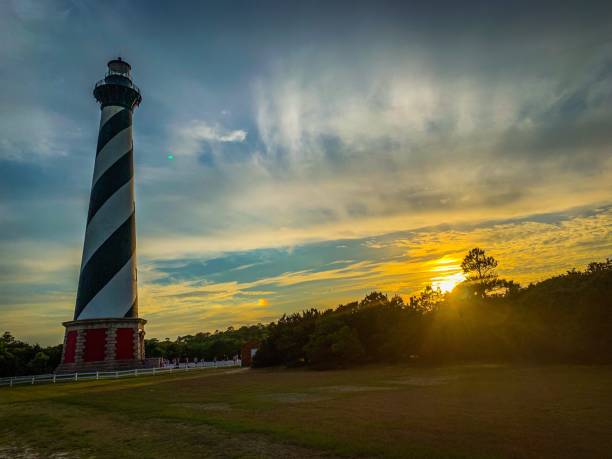 Cape Hatteras Lighthouse Sunset at Cape Hatteras Lighthouse, Buxton, North Carolina, USA cape hatteras stock pictures, royalty-free photos & images