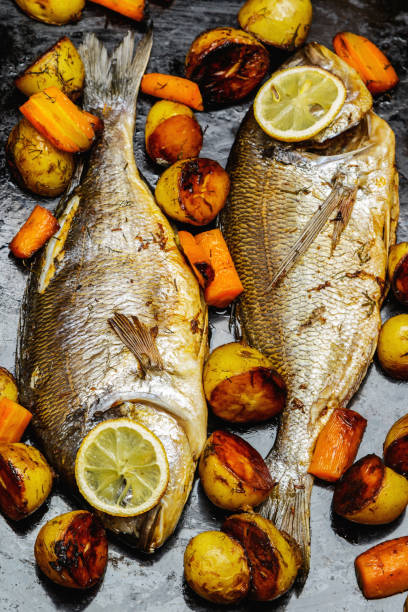 istock Baked Dorado fish with vegetables 1182299119