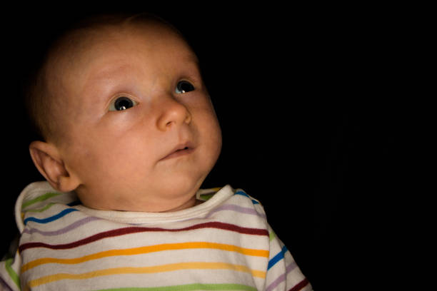istock Baby Hayden on Black at 2 Months Old 1182299586