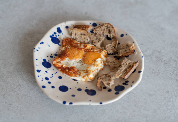 istock fried eggs with sesame, served with sour dough toast 1182301034