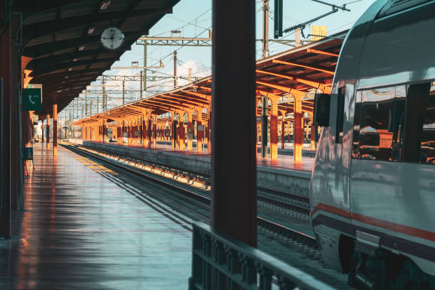istock Travel by train concept. Empty station with train ready to leave. Sunset Autumn Light. Madrid, Spain. 1182301538