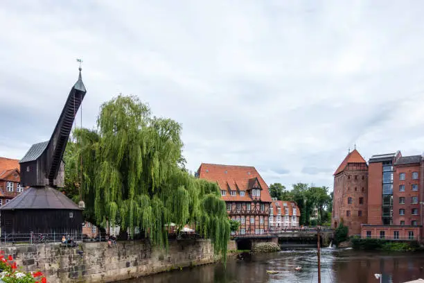 Old historic harbor of Luneburg with half-timbered houses and crane an river in Schleswig-Holstein Germany