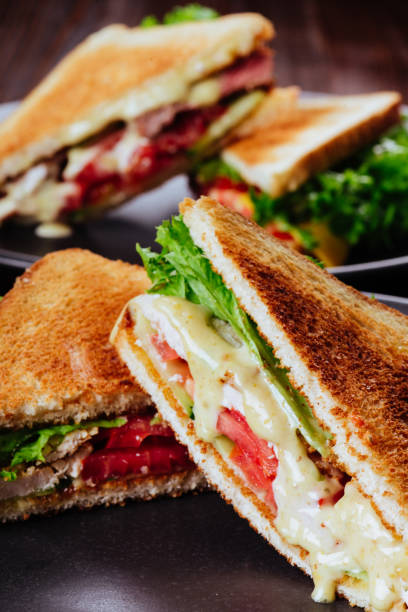 istock Sandwich bread tomato, lettuce and yellow cheese 1182303693