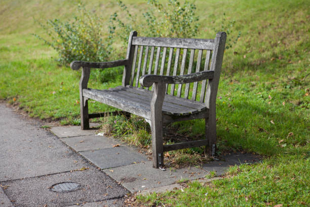 istock Old destroyed bench on the street in the park 1182303889