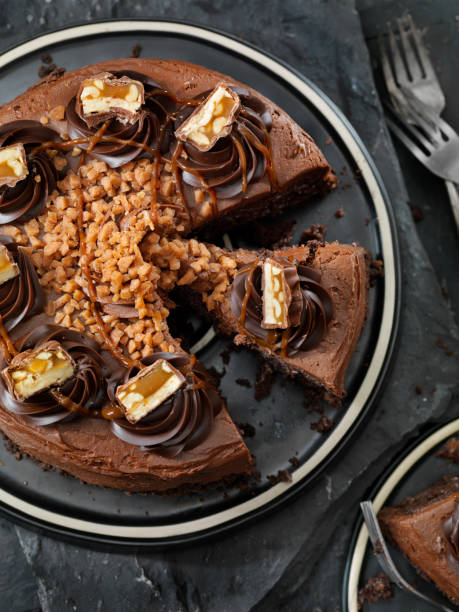 istock Caramel, Butter Toffee Crunch Chocolate Cake with Candy Bar Pieces 1182304526