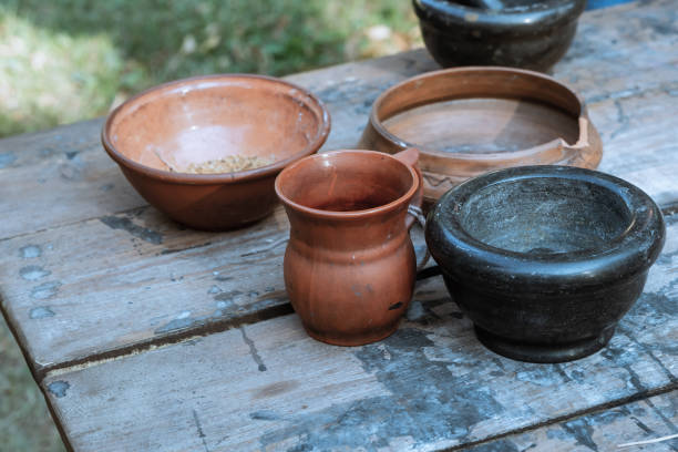 istock pair earthenware dishes pot rustic dishes natural material background rustic on a wooden table 1182304904