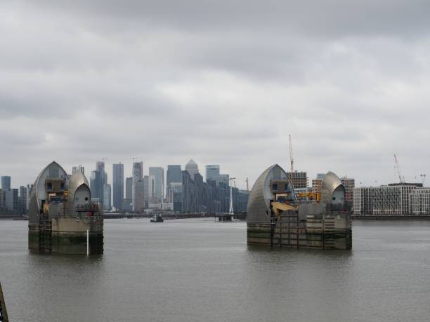 istock Thames Barrier against canary wharf 1182306224