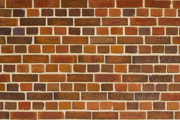istock Vintage brown multi-hued brick wall texture in English bond pattern 1182307193