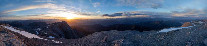 Sunrise at HochkÃ¶nig. In the background the Dachstein Mountains are visible left to the sun. Autumn is about to settle in the valleys with first patches of snow on the mountain summits.