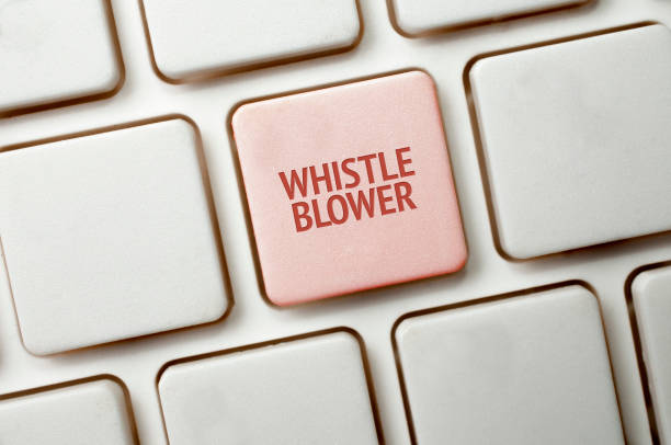 A Black keyboard with a red key and the whistleblower word Whistleblowing concept: White keyboard with a red key and the whistleblower word whistleblower human role stock pictures, royalty-free photos & images