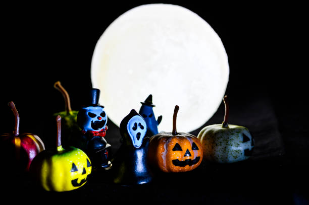 istock Halloween still life with pumpkin lights and devil 1182312346