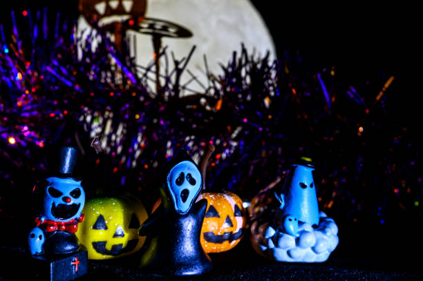 istock Halloween still life with pumpkin lights and devil 1182312543