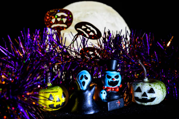 istock Halloween still life with pumpkin lights and devil 1182312628