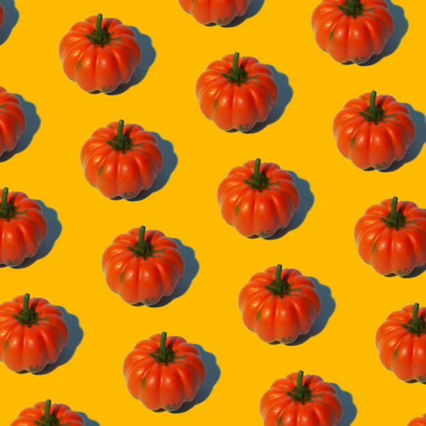 istock Conceptual halloween pattern with decorative pumpkin on a yellow background. 1182313593