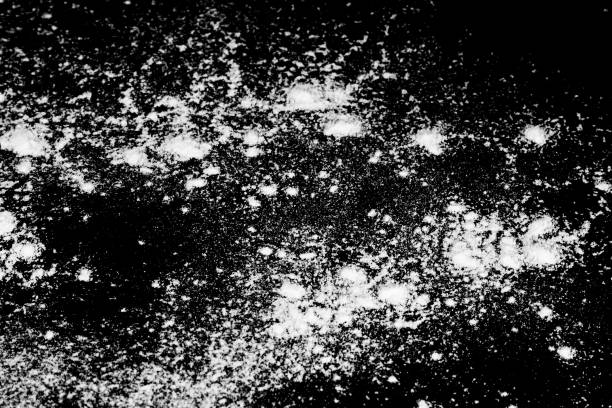 istock White powder on black background 1182315148
