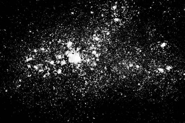 istock White powder on black background 1182315177