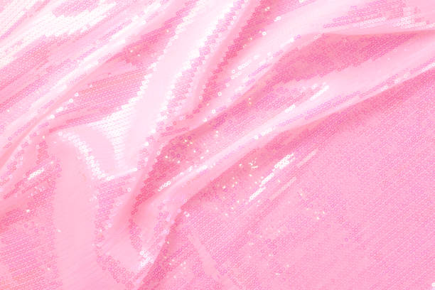 istock Large shiny glossy pink sequins background. 1182319217